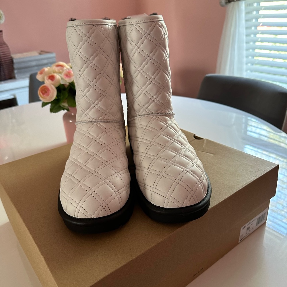 White quilted Ugg Boots.